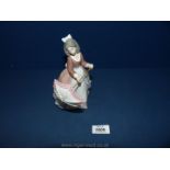 A Lladro figure Nos. 5210, 'young lady with parasol'.
