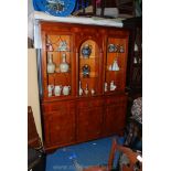 A contemporary Yewwood finished Cabinet on Cupboard,