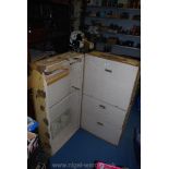 A large Victorian travel trunk in cream with drawers and wardrobe space, locks a/f.