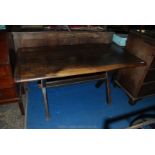 An unusual cross legged Oak Tavern type Table with central pegged stretcher,