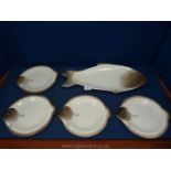 A Longwy fish shaped serving Dish and four plates.