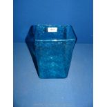 A square blue glass vase