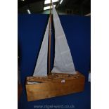 A 1930's pond Yacht on stand.