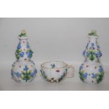 A 19th century Meissen flower encrusted cup on peg feet and a pair of Dresden JR marked flower