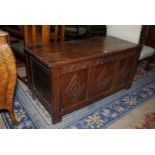 A good three panel Oak blanket Chest having carved diamond decoration to the panels with repeated