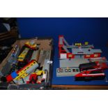 A Lego train and station and small quantity of track.