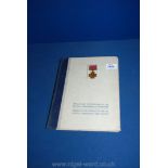 A book of Medals and Decorations of the British Commonwealth of Nations having some tobacco cards