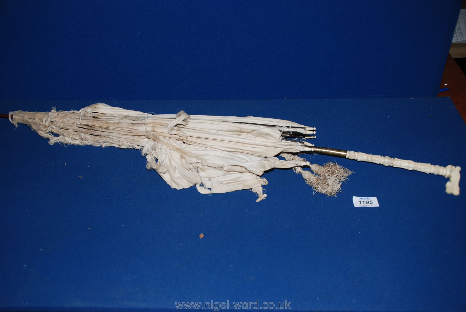 A bone/ ivory handled Parasol.