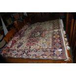 An eastern design, bordered, patterned and fringed Rug,