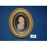 An oval deeply framed three dimensional sculpted Bust of a lady with flowing locks,