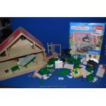 A Sylvanian house together with miscellaneous furniture and cardboard orchard.