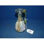 A highly collectable Roman glass Ewer/Jug of pale green colour with iridescence,
