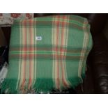 A large pink/green Welsh wool blanket.