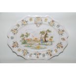 A large antique armorial Moustiers Platter finely painted with a mythological scene,