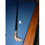 An ebony cane with silvered horse head handle.