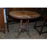 A circa 1900 oval mixed woods occasional Table having inlaid decoration with urns and swags to the