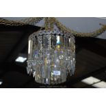 A fine old crystal chandelier having a two stage circle of 36 prisms to the exterior with 22 plain