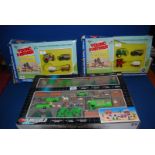 A Playworld playset including farm and two young farmer playsets, boxed.