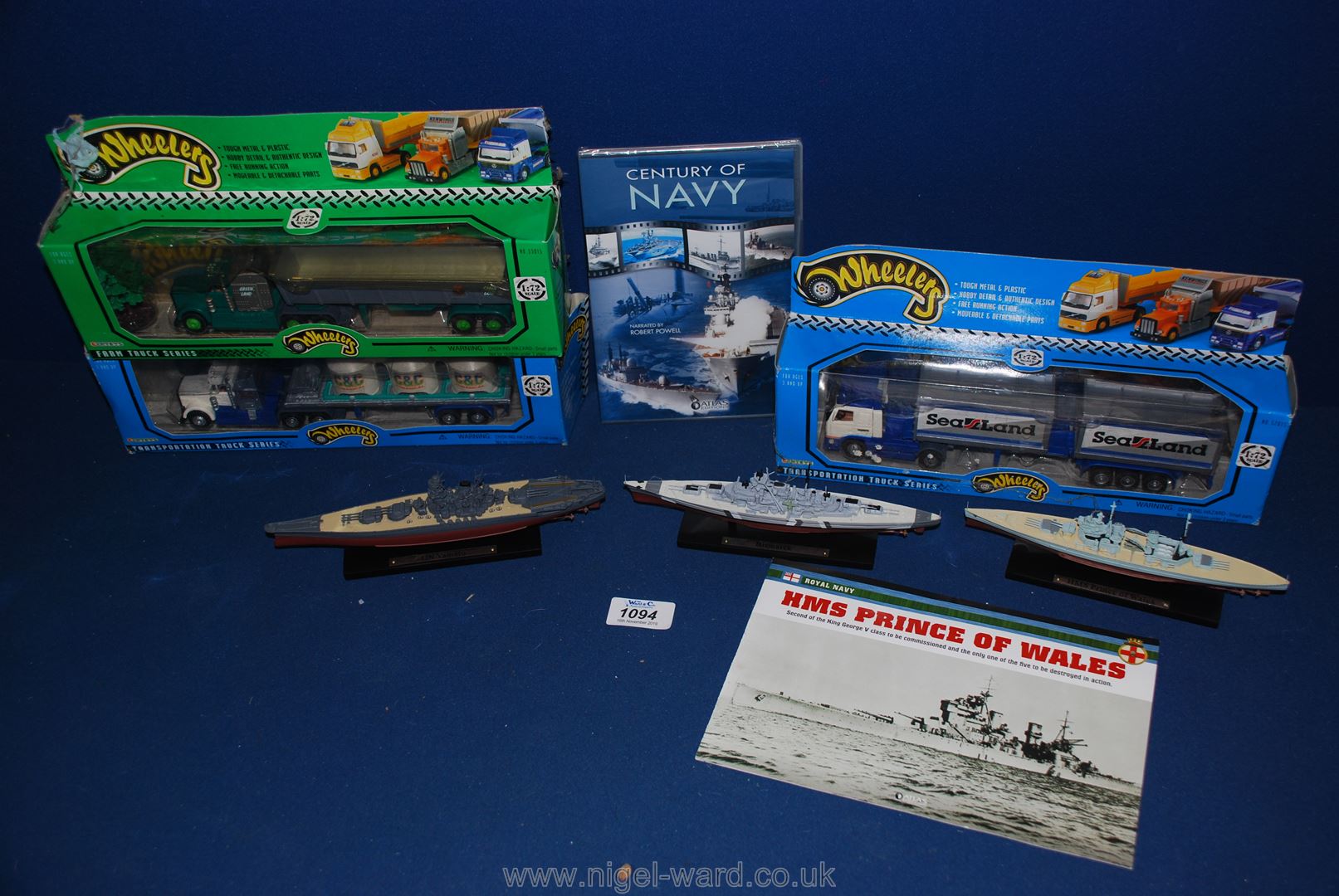 Three model ships together with three boxed Wheelers lorries.