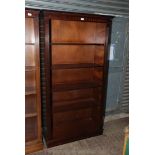 A contemporary set of floor standing Mahogany Bookshelves having dentil frieze,