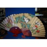 Two large Oriental fans.