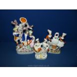 Three flat back Staffordshire figurines of Victoria, couple under tree and two girls dancing.