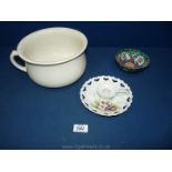 A white chamber pot a present from Llandrindod Wells,