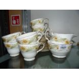 A part Duchess tea set white with gold coloured rims and yellow and green flowers including six