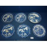 Six blue and white plates and one other,