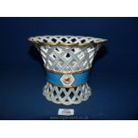 A fine quality porcelain white ground blue and gilt decorated lattice pierced Table Centrepiece