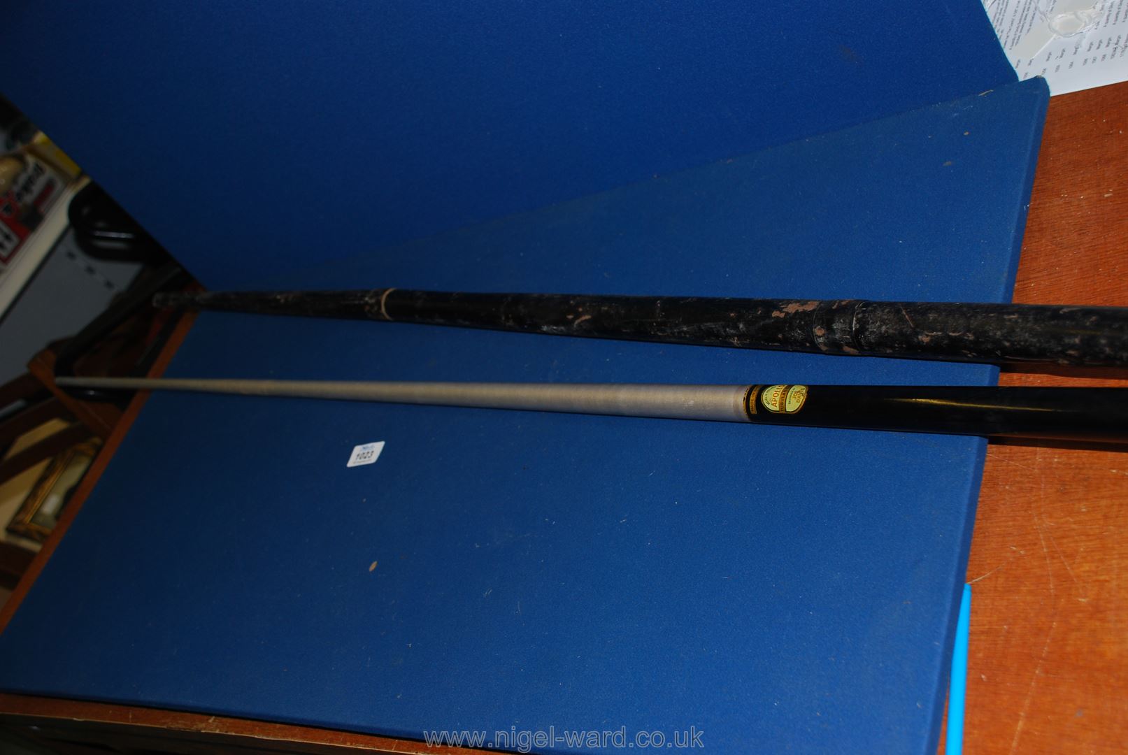 An English made Tubular Cue by Apollo Accles and Pollock in a metal sleeve.