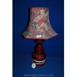 A brown china Lamp with multi-colour shade.