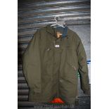 A Regatta waterproof and breathable green Jacket, size UK 38.