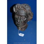 A plaster bust of a lady's head.