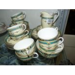 A Royal Worcester 'Daytona' tea service, consisting of nine cups, eleven saucers, twelve tea plates,