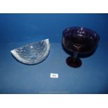 A glass fruit Bowl together with purple stemmed bowl.