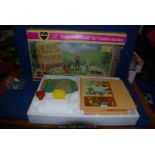 A Sindy boxed greenhouse, planters and flower pots.