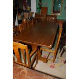 An Oak refectory style Dining Table by Timothy Hawkins of Bartestree having fretworked end supports