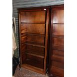 A contemporary set of floor standing Mahogany Bookshelves having dentil frieze,