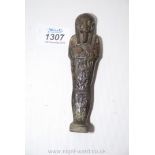 A good ancient Egyptian shabti, faience glazed in greenish black and incised with hieroglyphs,