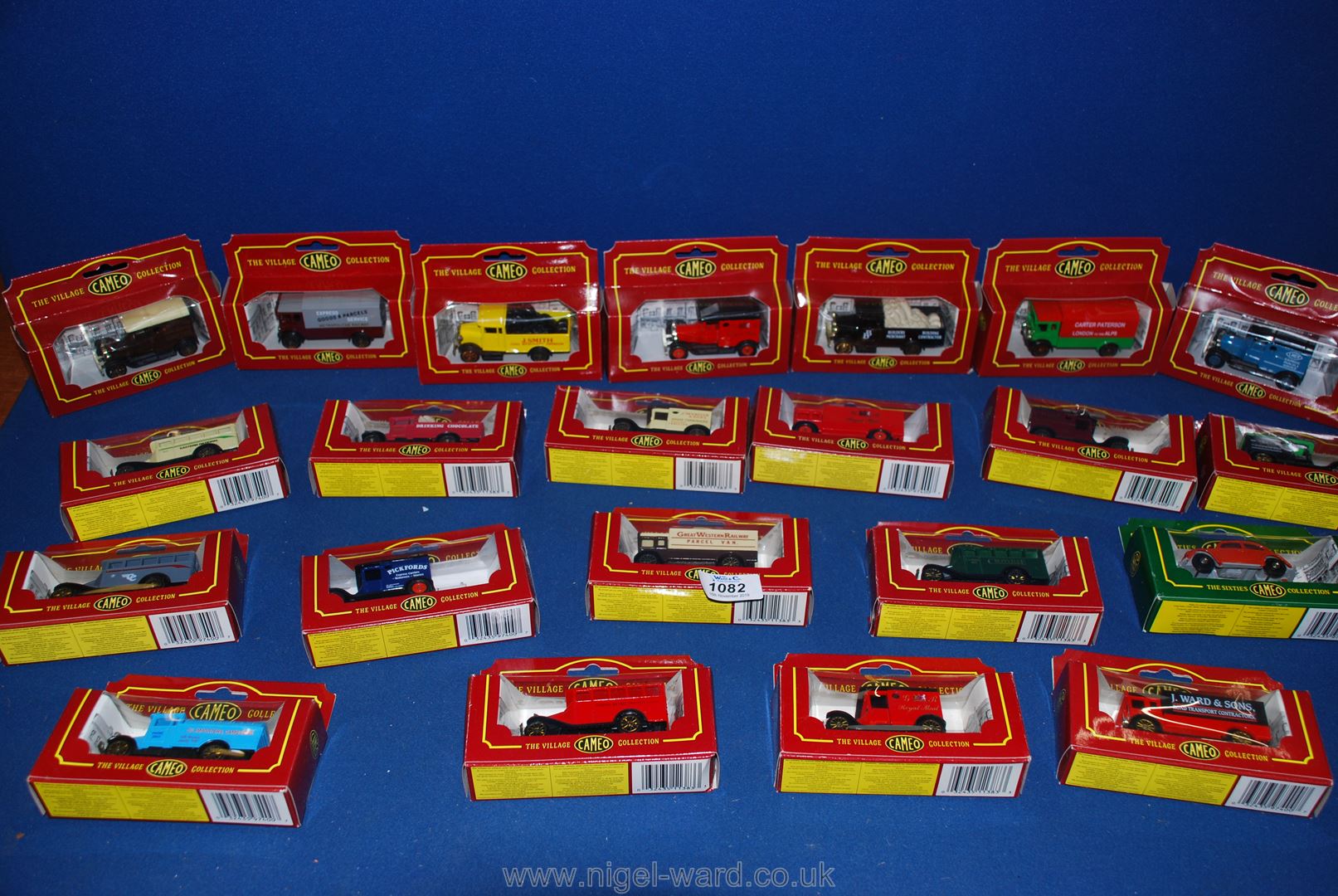 A quantity of boxed Village Cameo collection vans and cars.