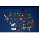 A tray of badges, medallions etc.
