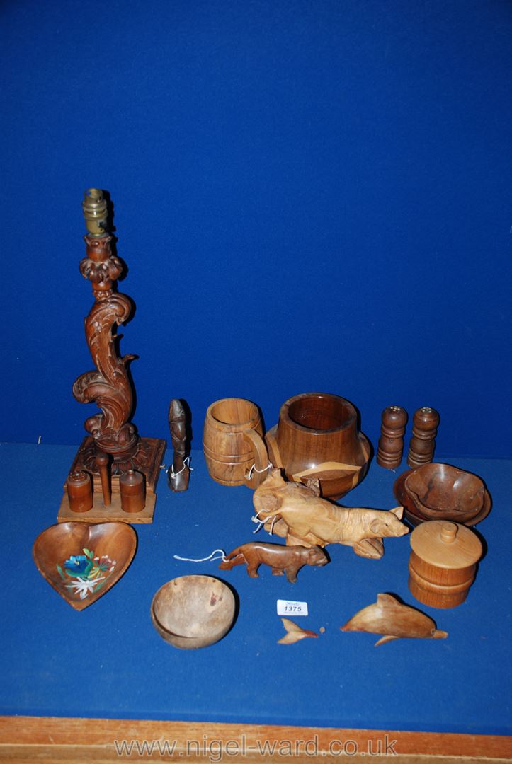 A box of treen including wooden animals, bowls etc.