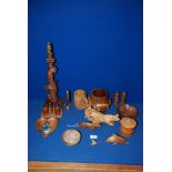 A box of treen including wooden animals, bowls etc.