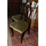 A set of four Edwardian Mahogany framed Dining Chairs of delicate design,