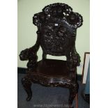 An imposing ebonised open armed chinoiserie Armchair,