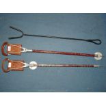 Two shooting sticks with leather covered handles and seats, a/f.