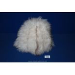 A Russian white fox fur hat.