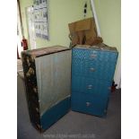 A well travelled ''Oshkosh Trunks Inc'' Trunk/portable wardrobe having metal bound corners,