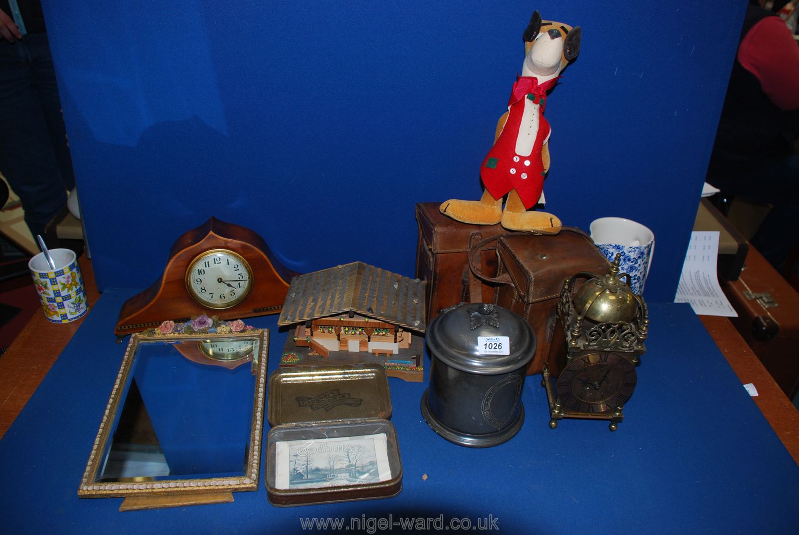 A quantity of miscellanea to include two WWI leather army lamp holders, brass lantern clock,